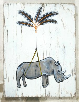 A painting on a rough wooden panel of a rhino with a flicker feather parachute.