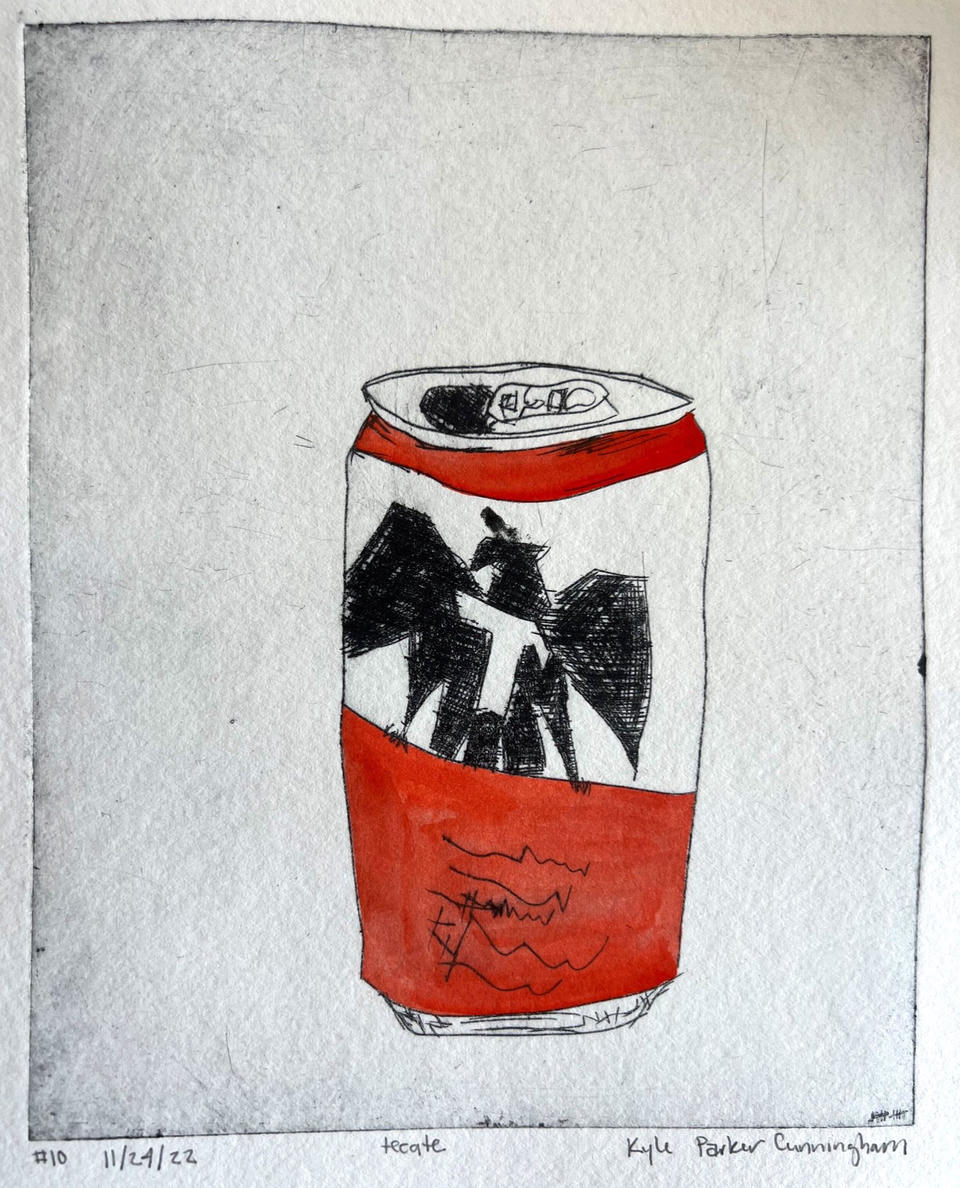 Close-up view of a drypoint intaglio print of a Tecate beer can, hand-colored with red-orange watercolor on the top rim and bottom half, with a bold black eagle emblem in the center, on handtorn paper.
