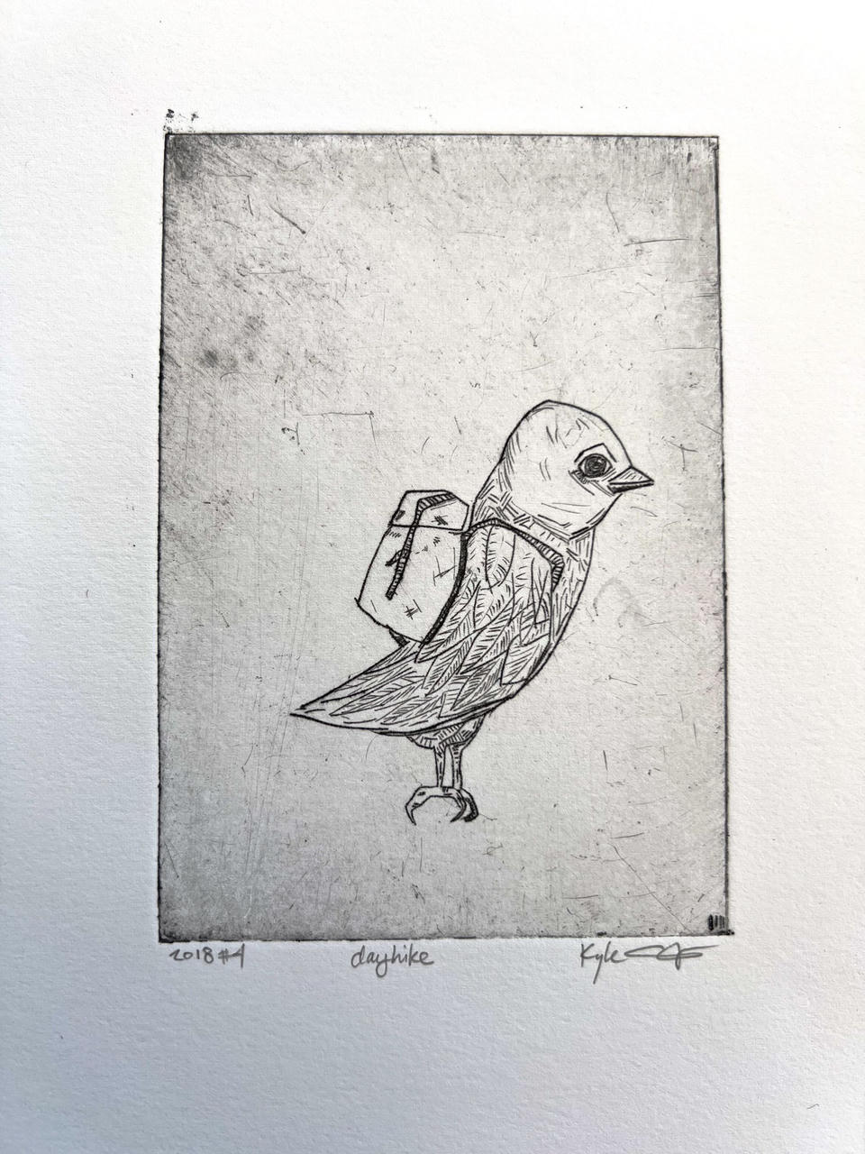 Black and white intaglio print of a small bird wearing a backpack, standing in profile facing right with detailed cross-hatched feathers and a single visible eye, on a softly toned gray background.