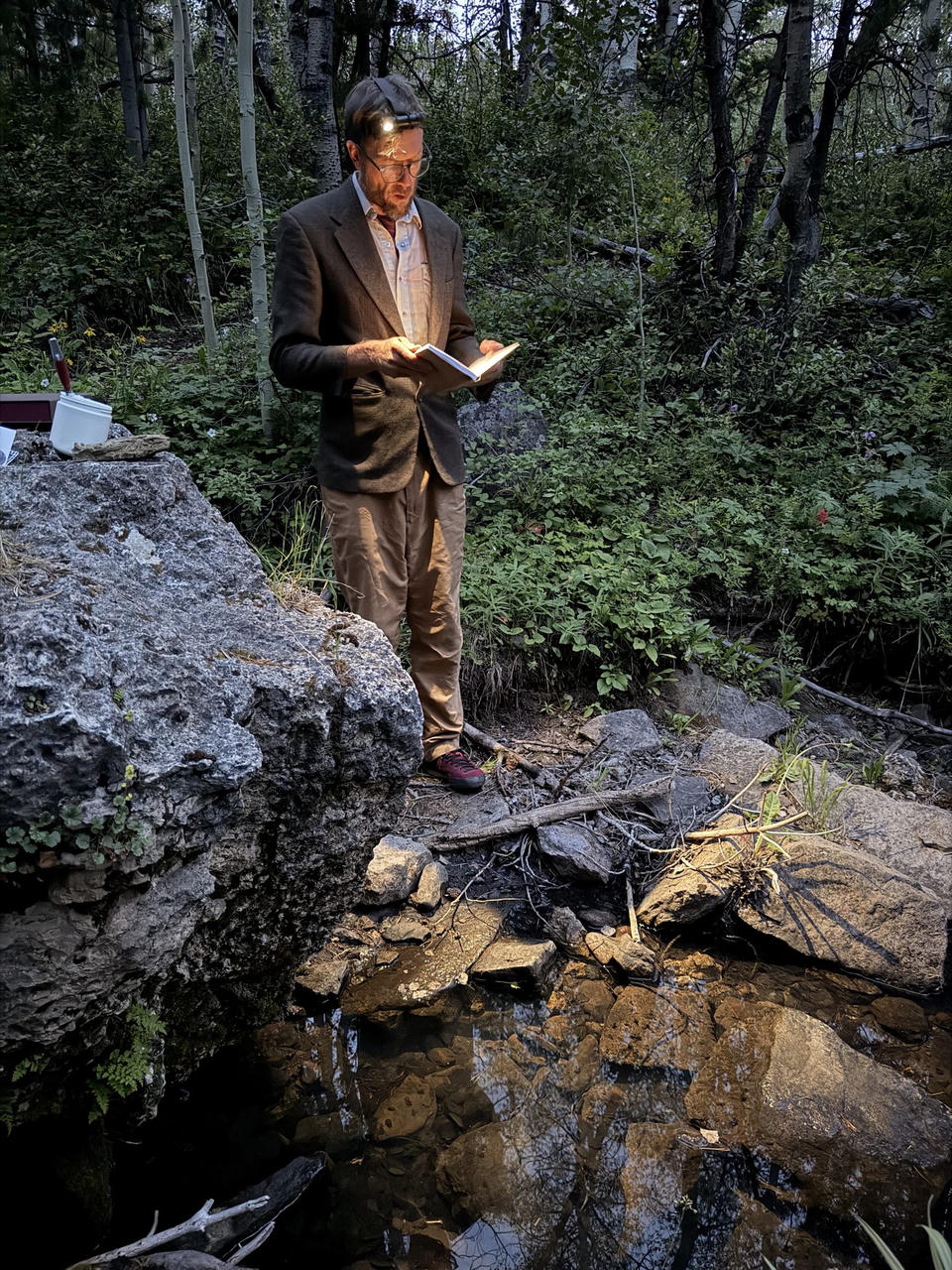 Reading the finished book on a rock in period dress