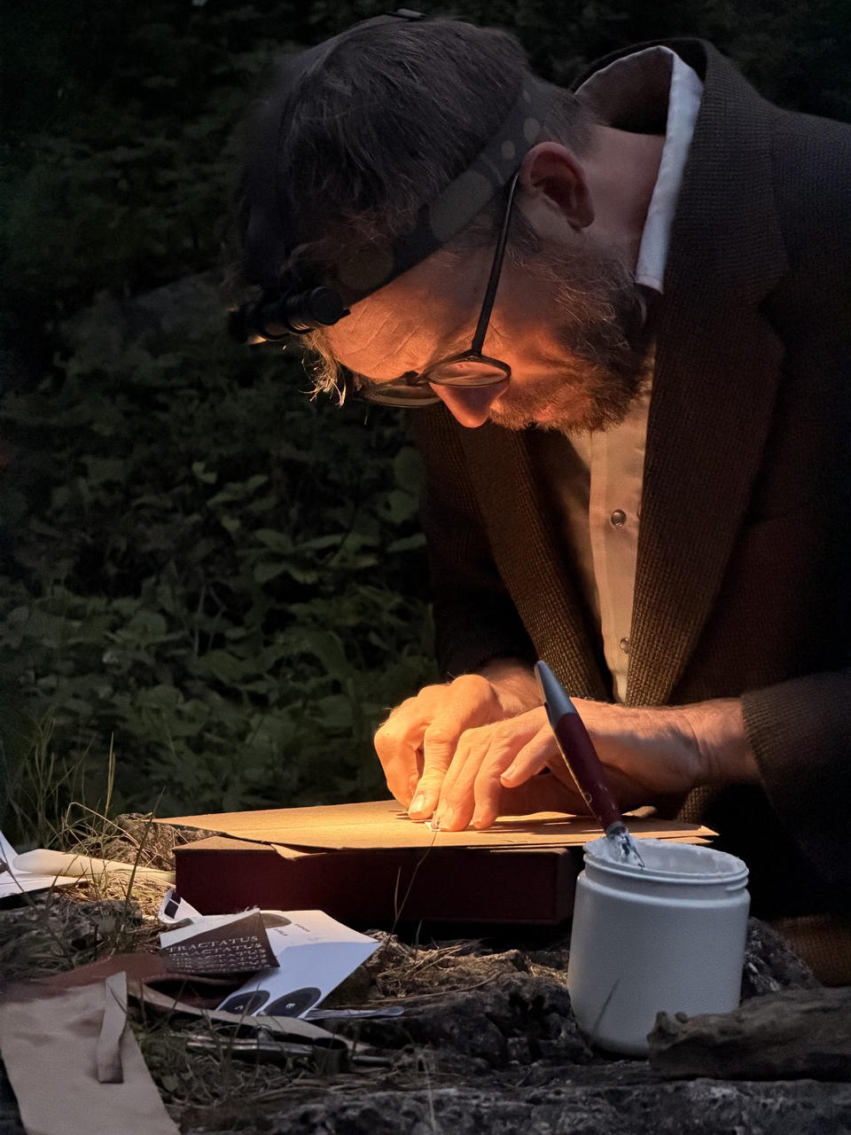 Close-up of sewing the boards by headlamp